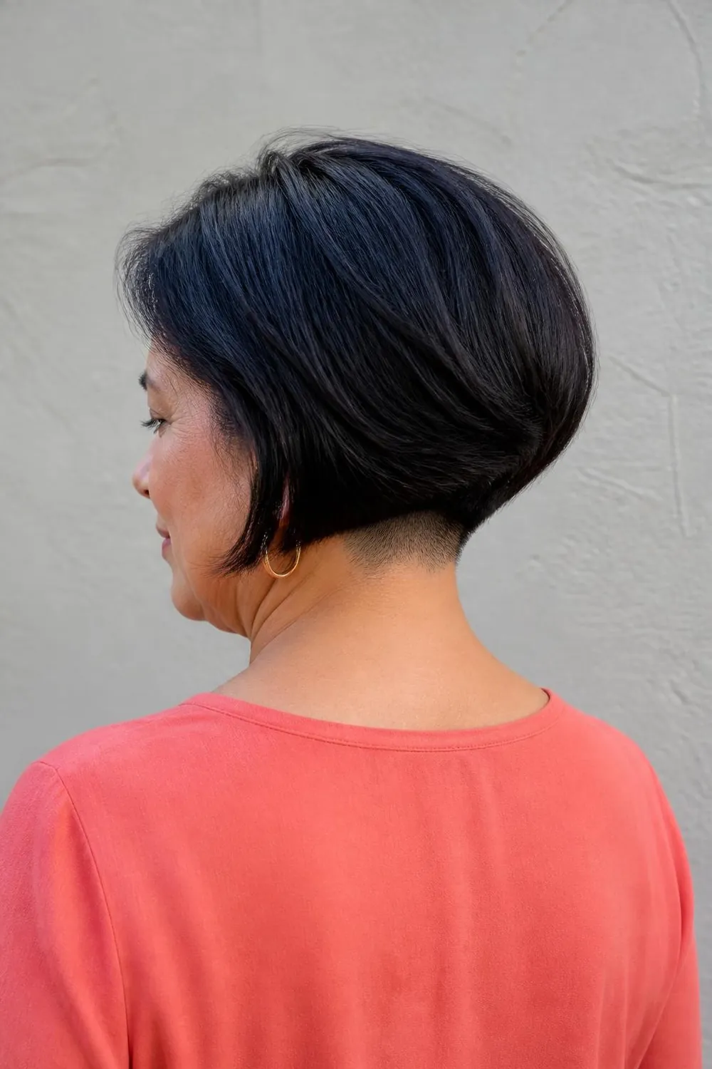Thick hair bob with a hidden undercut at the nape for women over 50
