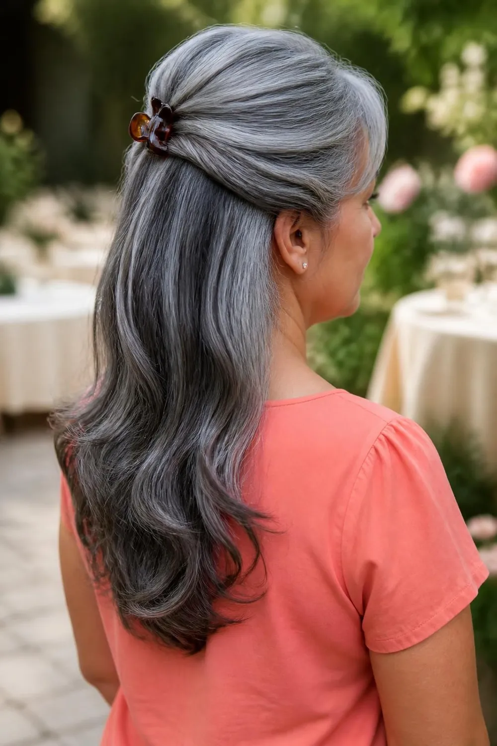 Medium gray hair in a half-up twist pinned at the crown