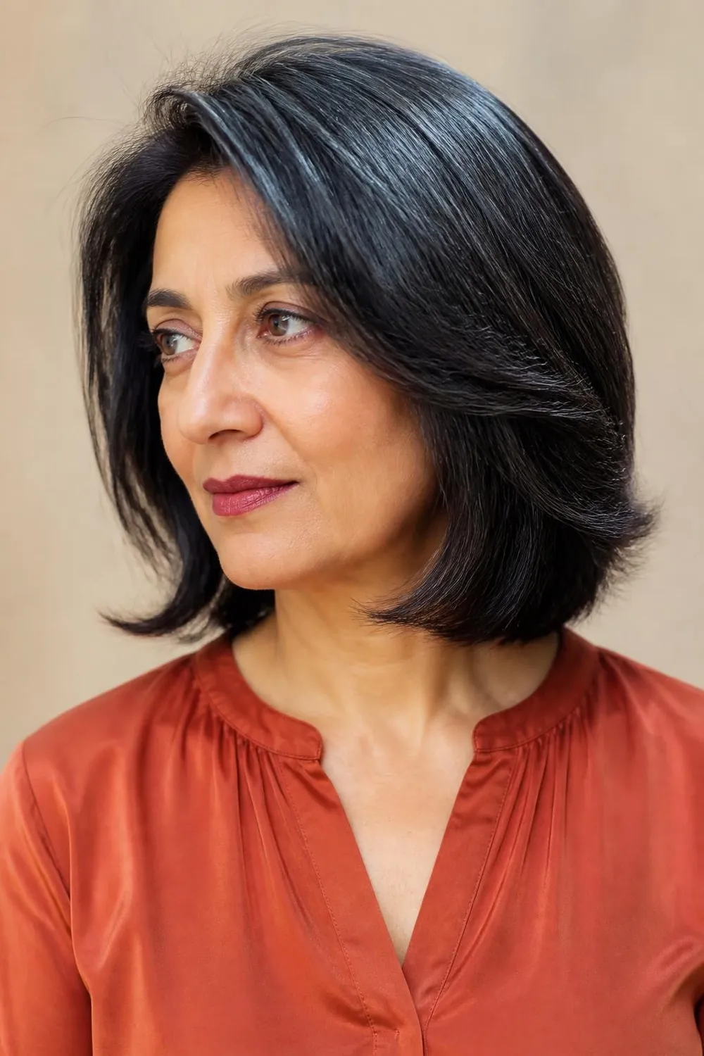 Point-cut lob with soft textured ends for a woman over 50 with thick hair