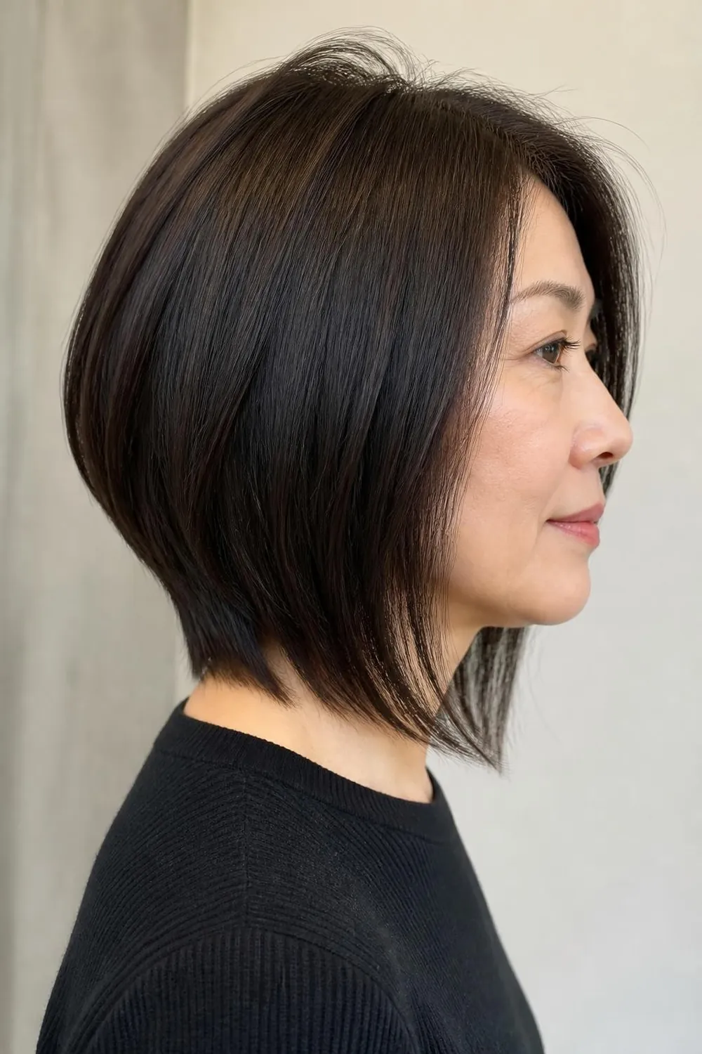 Long graduated bob with stacked back layers and a longer front for a woman over 50