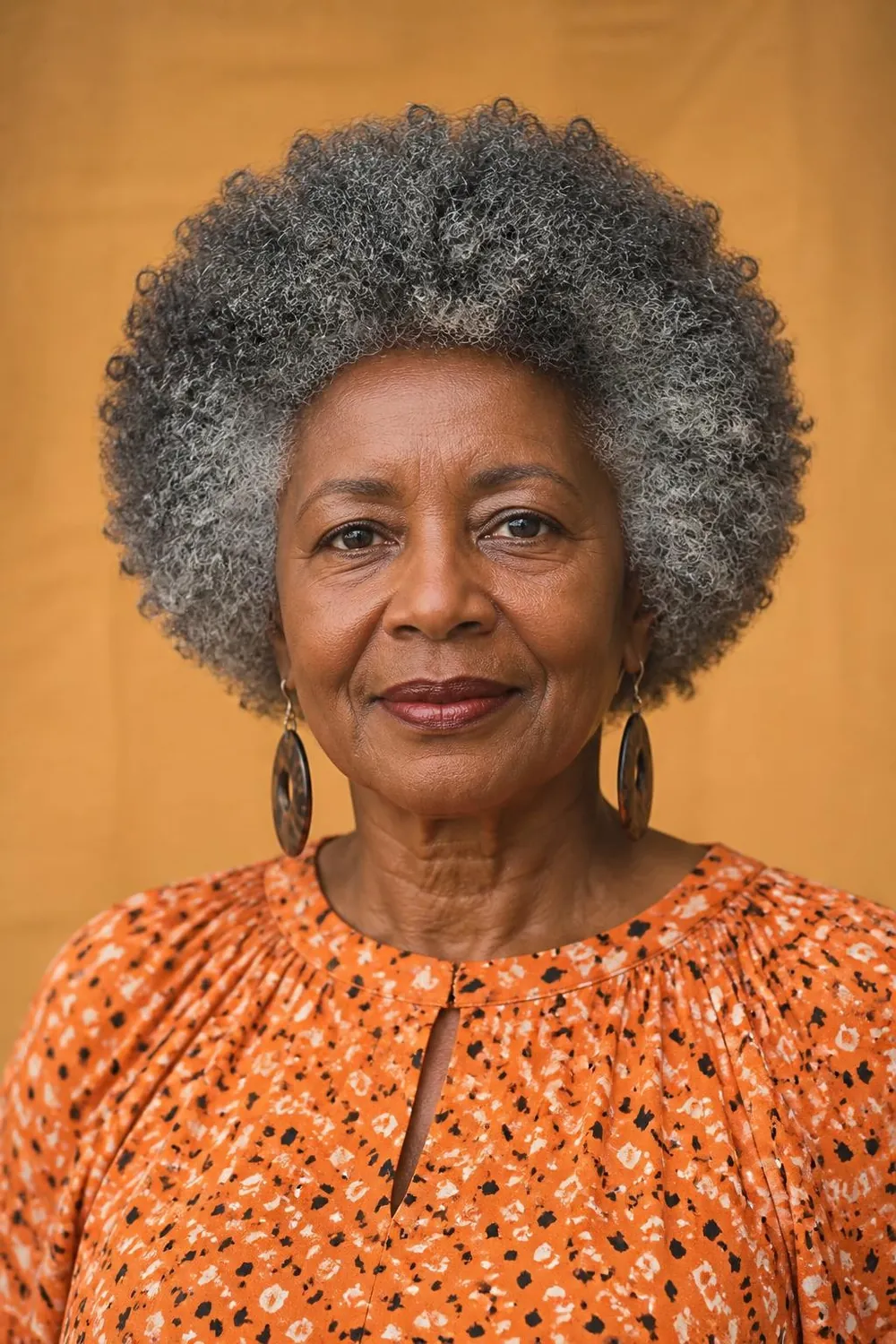 Shaped coily afro rounded by a stylist for Black women over 60 with natural hair