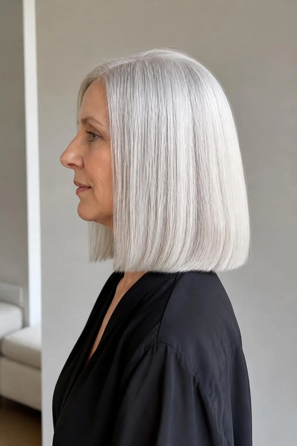 Silver shoulder-length cut with a glossy smooth finish for women over 60 with gray hair