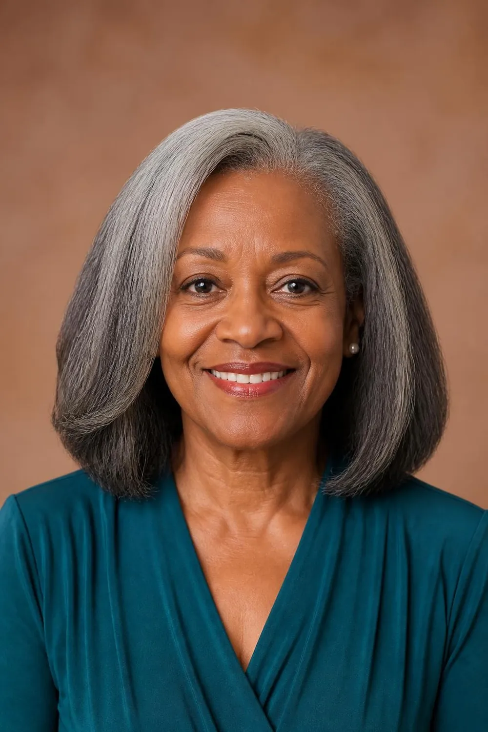 Natural coily hair shaped to shoulder length for Black women over 60