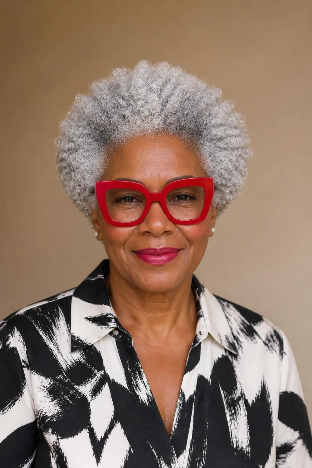 Rounded natural coils with bold statement glasses for Black women over 60