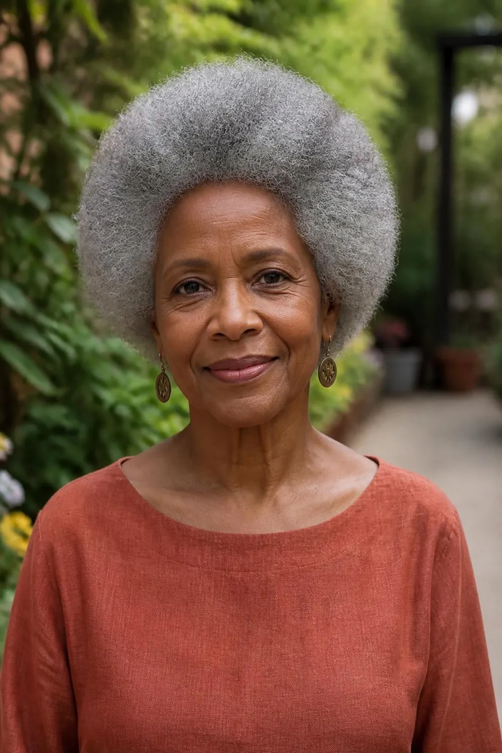 Round silver afro shaped evenly on a Black woman in her early 70s