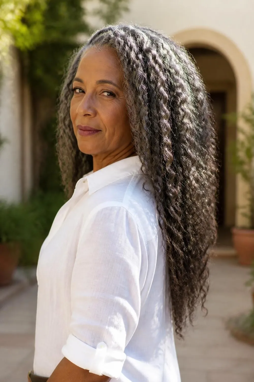 Braid-out with stretched defined waves on medium natural hair, Black woman in her 60s