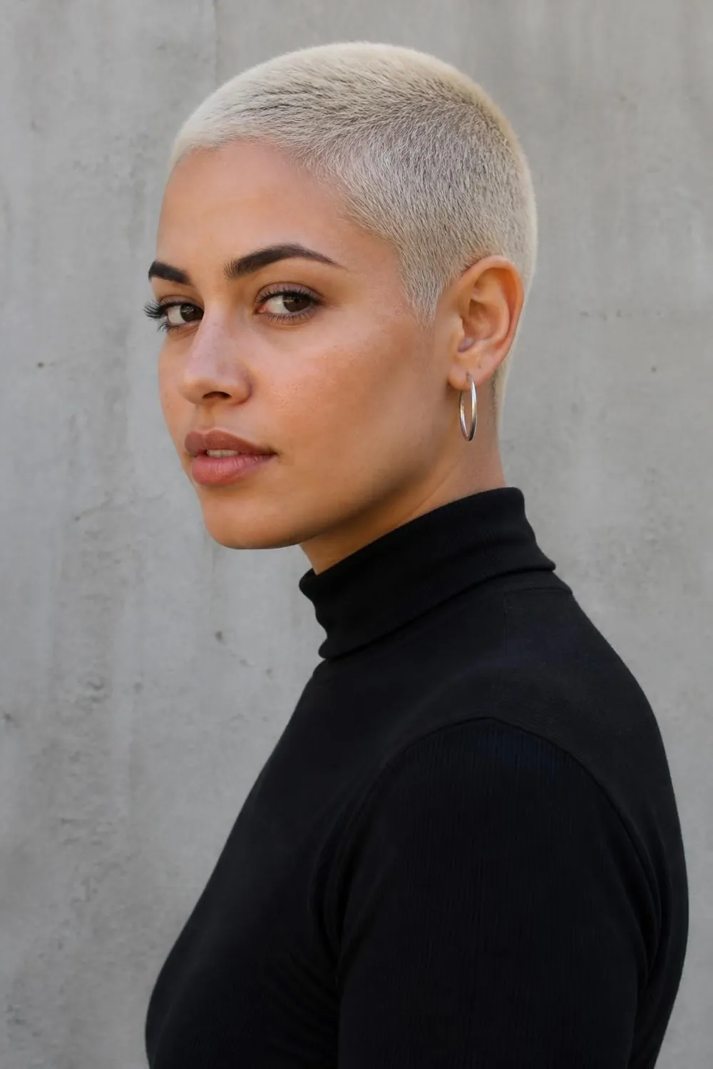 Platinum blonde buzz cut, the boldest short haircut for women who love color