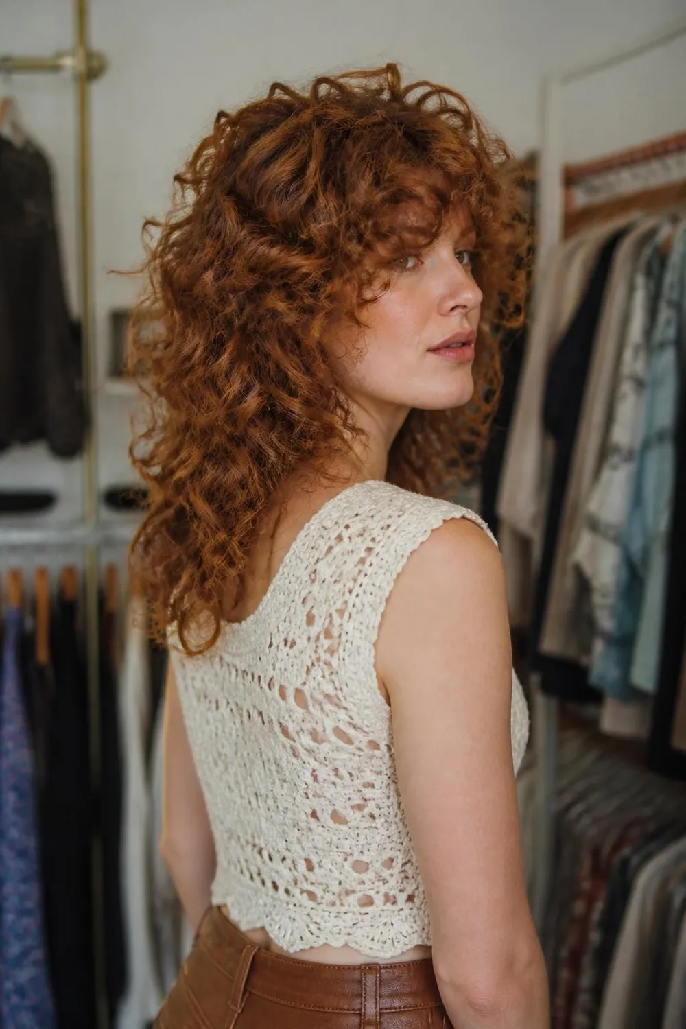 Curly shag with stacked crown layers and airy loops for 3A curls