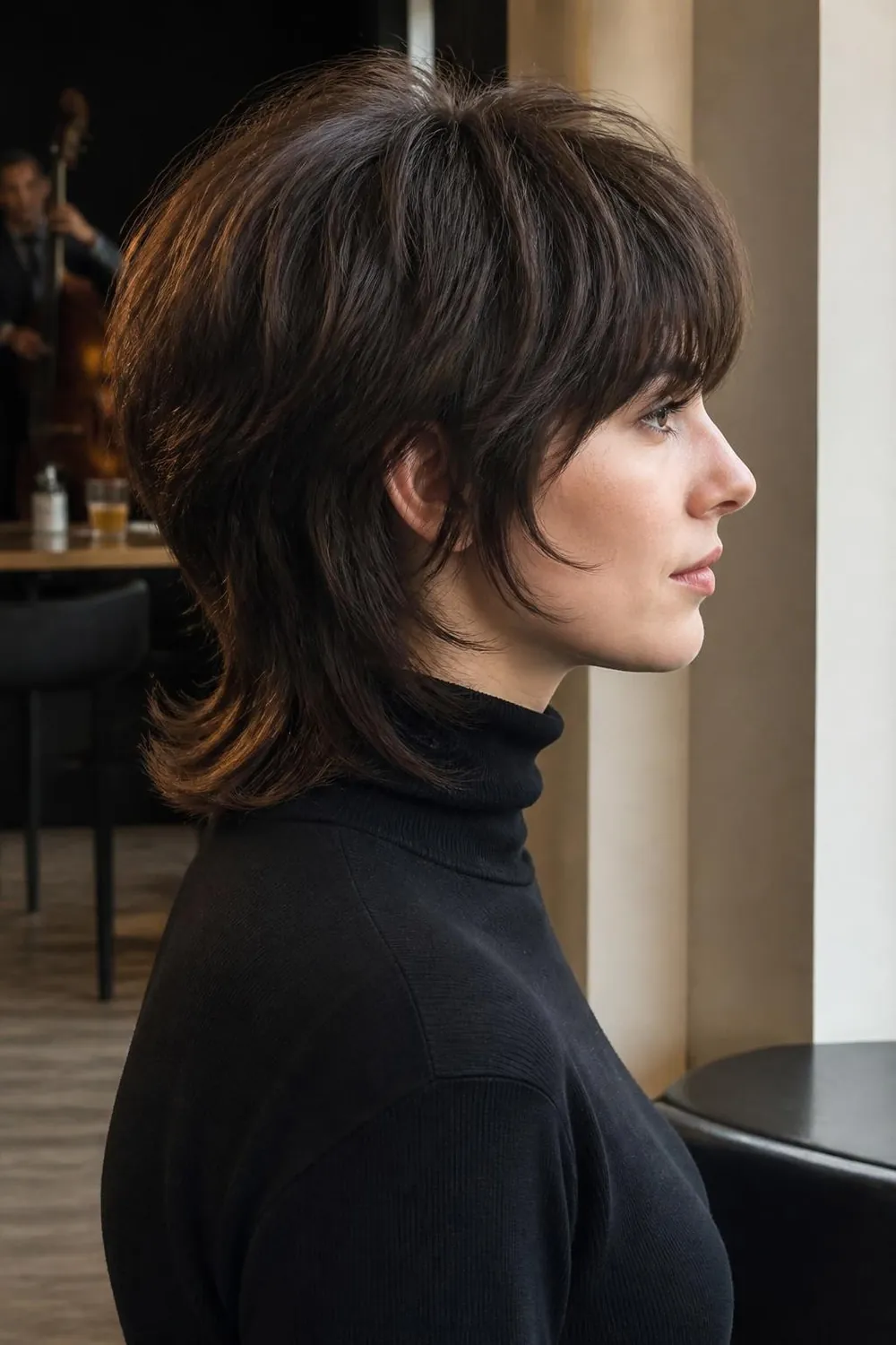 Shaggy mod cut with choppy layers and a rounded crown for oval faces